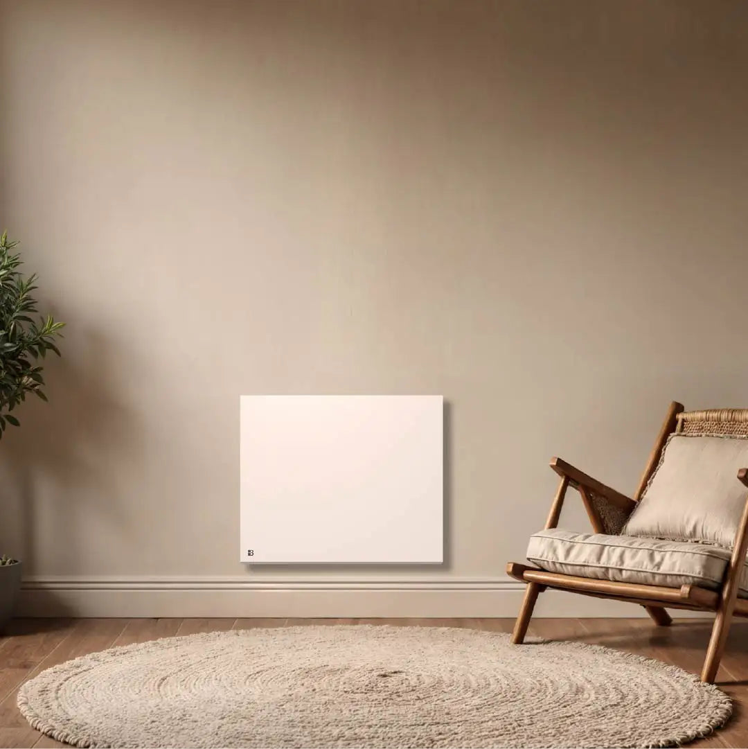 Radiateur électrique à inertie sèche céramique WiFi NESSA CONNECT Bestherm installé dans un salon moderne avec thermostat connecté programmable