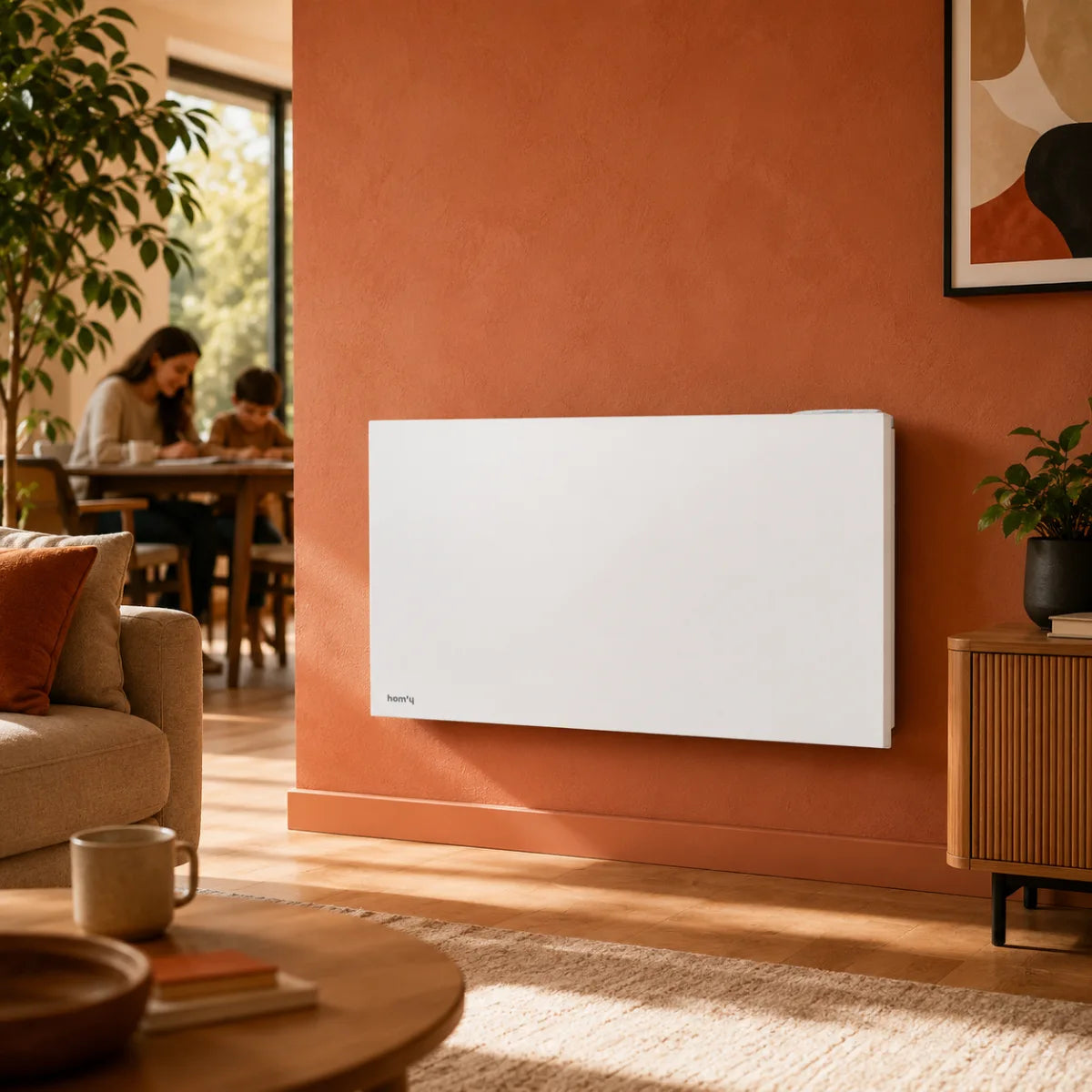 Radiatore connesso a inerzia secca in ceramica ORPHÉE CONNECT in un soggiorno caldo e moderno