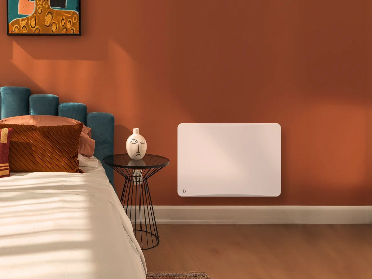 Radiateur à inertie sèche céramique avec thermostat interchangeable OVEO dans une chambre d'ambiance